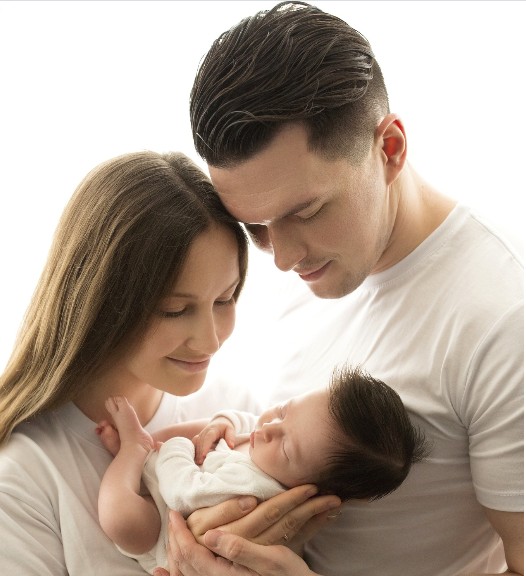Parents holding their newborn baby