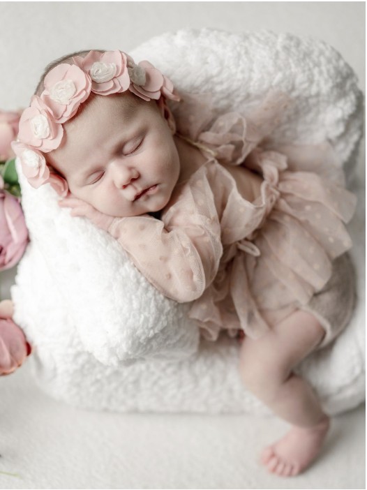 Newborn baby wrapped in soft pink, photographed by Little Memories Photography